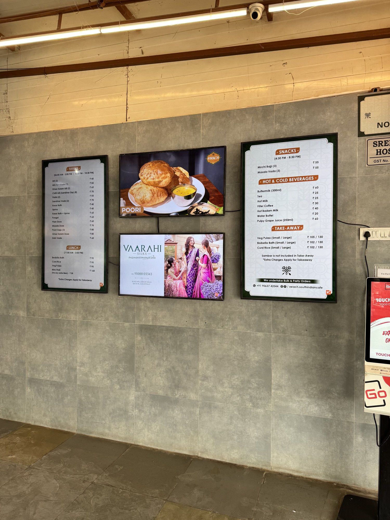 KMEDIA digital menu boards and Vaarahi Silks ad at Swach South Indian Cafe