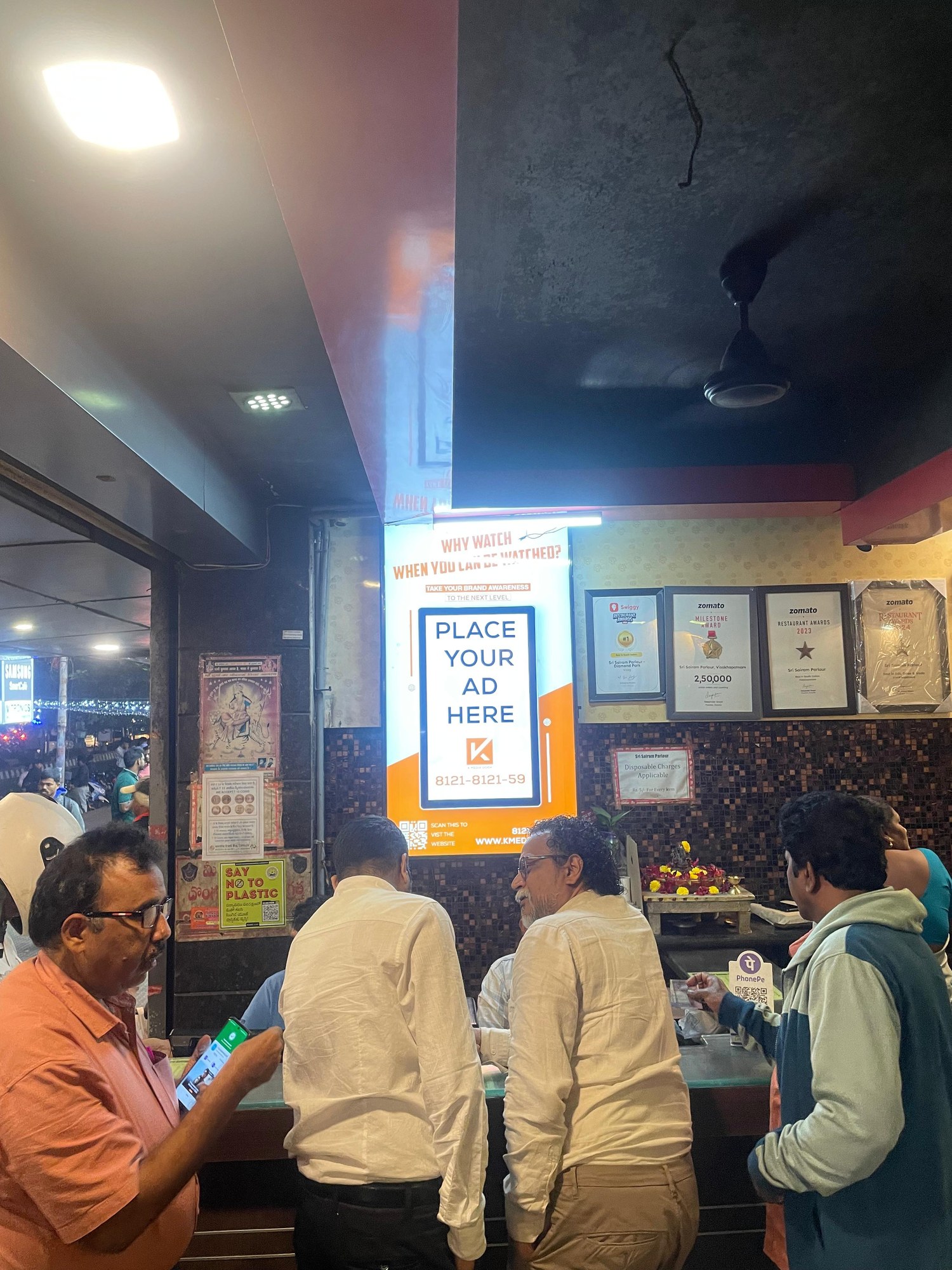 KMEDIA vertical ad screen at the award-winning Sri Sairam Parlour counter